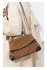 Brown frosted leather handbag shown on model for daily commuting style