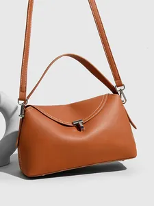 Brown litchi leather Lindy style crossbody bag with white stitching and silver hardware