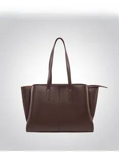 Close-up of coffee brown tote bag showing the fine pebble grain leather texture and seams