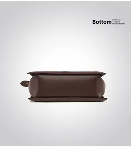 Detailed bottom view of large brown leather tote bag with sturdy reinforced seams