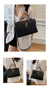 Détails du sac cabas noir minimaliste avec boucle dorée et bandoulière réglable