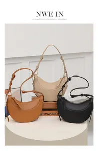 Vista detallada de tres bolsos hobo en caramelo, crema y negro con correas ajustables