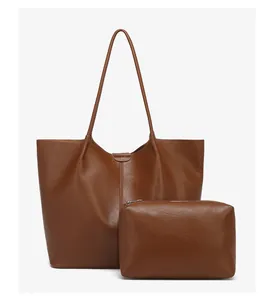 Brown leather tote bag and matching zippered pouch set with textured synthetic finish