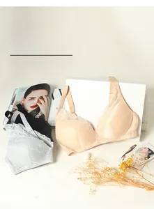 Detailed lace texture and wide straps of silk bras in beige, white, and black colors