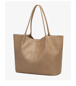 Detail of minimalist khaki tote bag showing high-quality PU leather texture and stitching