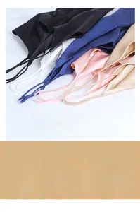 Detailed view of smooth silk satin fabric texture and thin straps on camisole tops