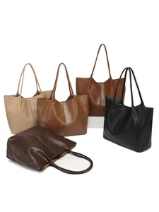 Large capacity tote bags in assorted colors on minimalist platforms for daily commuting