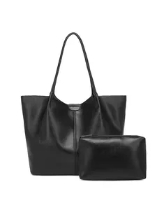 Minimalist black faux leather tote bag set with matching pouch on white background