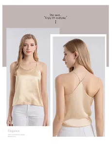 Macro detail of champagne silk camisole featuring slim straps and cross-back design