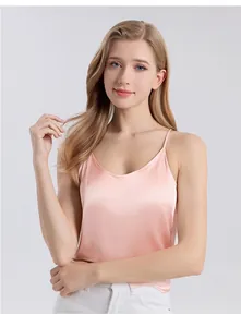 Close-up of pink silk camisole with thin straps and smooth satin texture for women