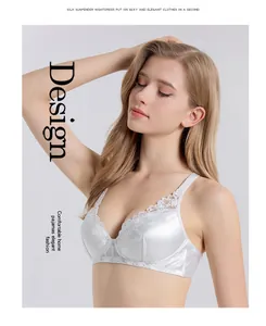 Detail of elegant white mulberry silk bra with delicate floral lace and slim straps
