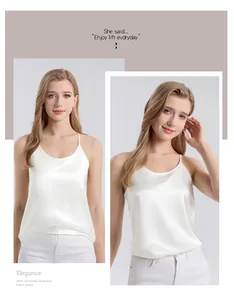 Detail showing the white silk camisole's satin texture and elegant thin strap design