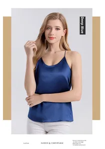 Detail view of dark blue silk camisole featuring delicate spaghetti straps and satin finish