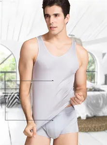 Close-up of premium grey silk vest showing smooth breathable fabric texture on male model