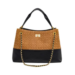 Handwoven bucket bag in brown and black leather patchwork with gold chain strap