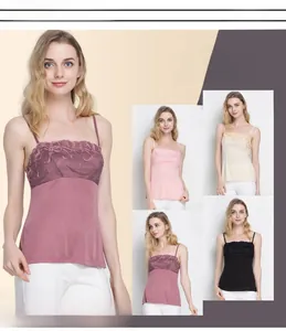 Detailed close-up of real silk camisole with floral lace embroidery in four colors