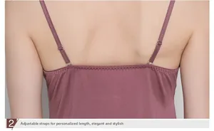 Detail view of adjustable silk camisole straps with transparent plastic buckles