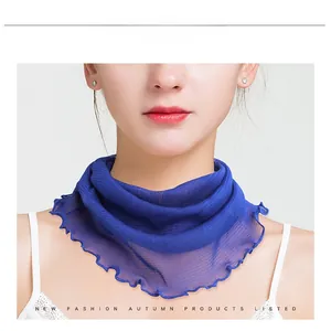 Detail of dark blue silk neck scarf with satin sheen and delicate rolled edge finish