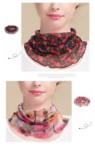 Detail of silk neck gaiter with vintage belt buckle print and wavy stitched edges