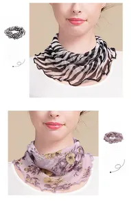 Detail of silk neck gaiter featuring zebra print and floral mesh knit with wavy edges