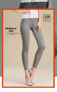 Detail showing the smooth silk texture and stretch of these grey cropped slim trousers