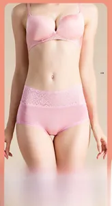 Detailed view of high-waist silk panties featuring delicate floral lace embroidery