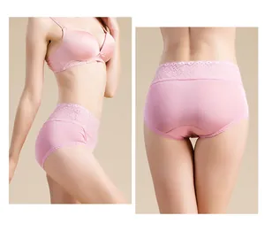 Detailed close-up of pink mulberry silk high-waist briefs with intricate floral lace trim