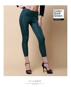 Close-up of women's dark green silk double-sided knit slim fit leggings in detail