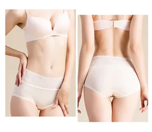 Detailed view of high-waist silk panties with elegant floral lace panels in beige