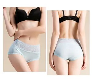 Detail of light blue silk high waist panties showing elegant lace trim and soft texture