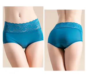 Detail showing high-waisted peacock blue silk panties with elegant lace hollowed edges