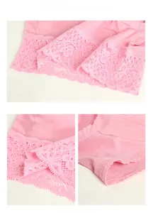 Detailed macro view of pink silk underwear featuring delicate lace trim and fine stitching