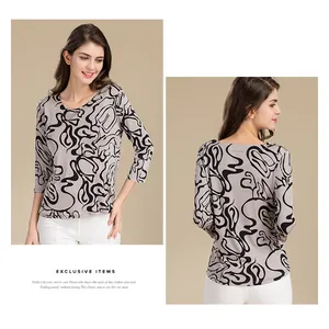 Front and back view of a women's silk knit top with black abstract spiral print