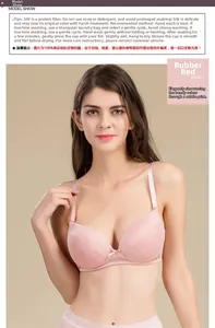 Detailed view of luxury mulberry silk bra in rubber red with floral lace and bow detail
