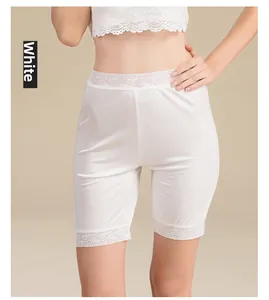 Detailed view of white mulberry silk under-shorts with delicate lace trimming edge