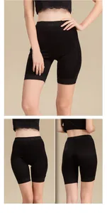 Detail view showing black high-waisted silk safety shorts with floral lace trim detail
