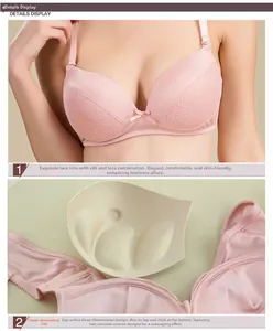 Detail of light pink silk lace bra with padded massage cups and push-up design