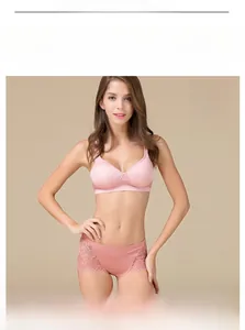 Detail view of model wearing a dusty rose silk bra and lace briefs set in size M