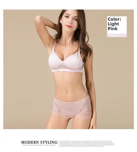 Close-up of light pink silk panties with lace edges and seamless modern styling