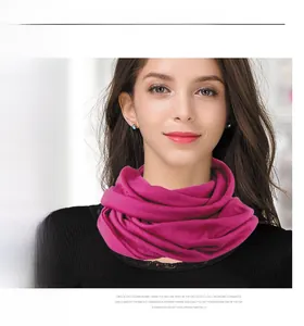 Detail of rose red seamless knitted wool neck warmer showing soft texture and snug fit