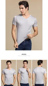 Close-up of light gray men's V-neck silk t-shirt showing premium texture and drape