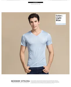 Detail of light blue silk V-neck T-shirt showing smooth fabric texture and slim fit design