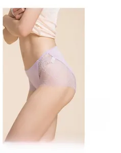 Detail of lavender silk panties featuring exquisite floral lace side panels on a model