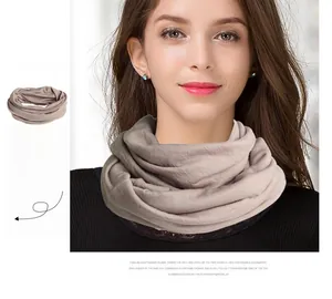 Detail view of khaki pure wool knit snood neck warmer on a model for winter comfort
