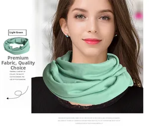 Detail showing light green knitted wool neck warmer with soft elastic ribbed texture