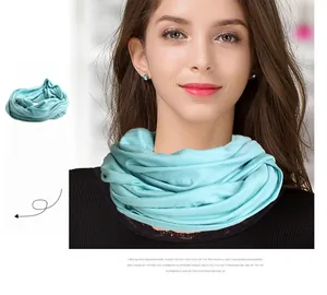 Detail showing water blue wool neck warmer with soft seamless texture for winter warmth