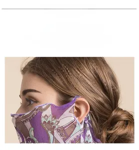 Detail of floral silk sun protection face mask with ear loops and breathable mesh fabric