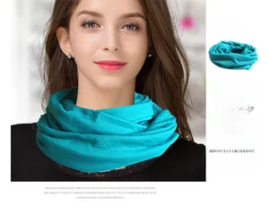 Close-up of a lake blue pure wool knit snood showing natural pleated texture and soft weave