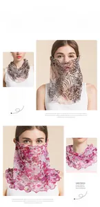 Detail of sheer silk sun protection neck gaiter with leopard print and floral patterns