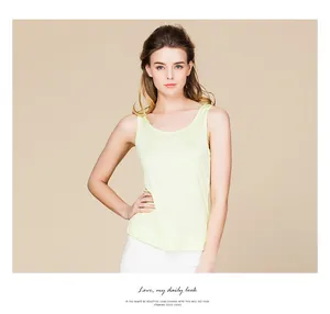 Detailed view of the sleeveless pale yellow silk tank top with a soft ribbed texture